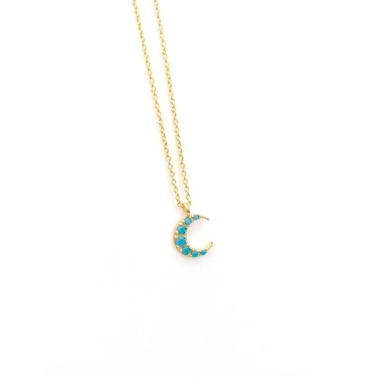 Tiny moon crescent with turquoise cubic zirconia