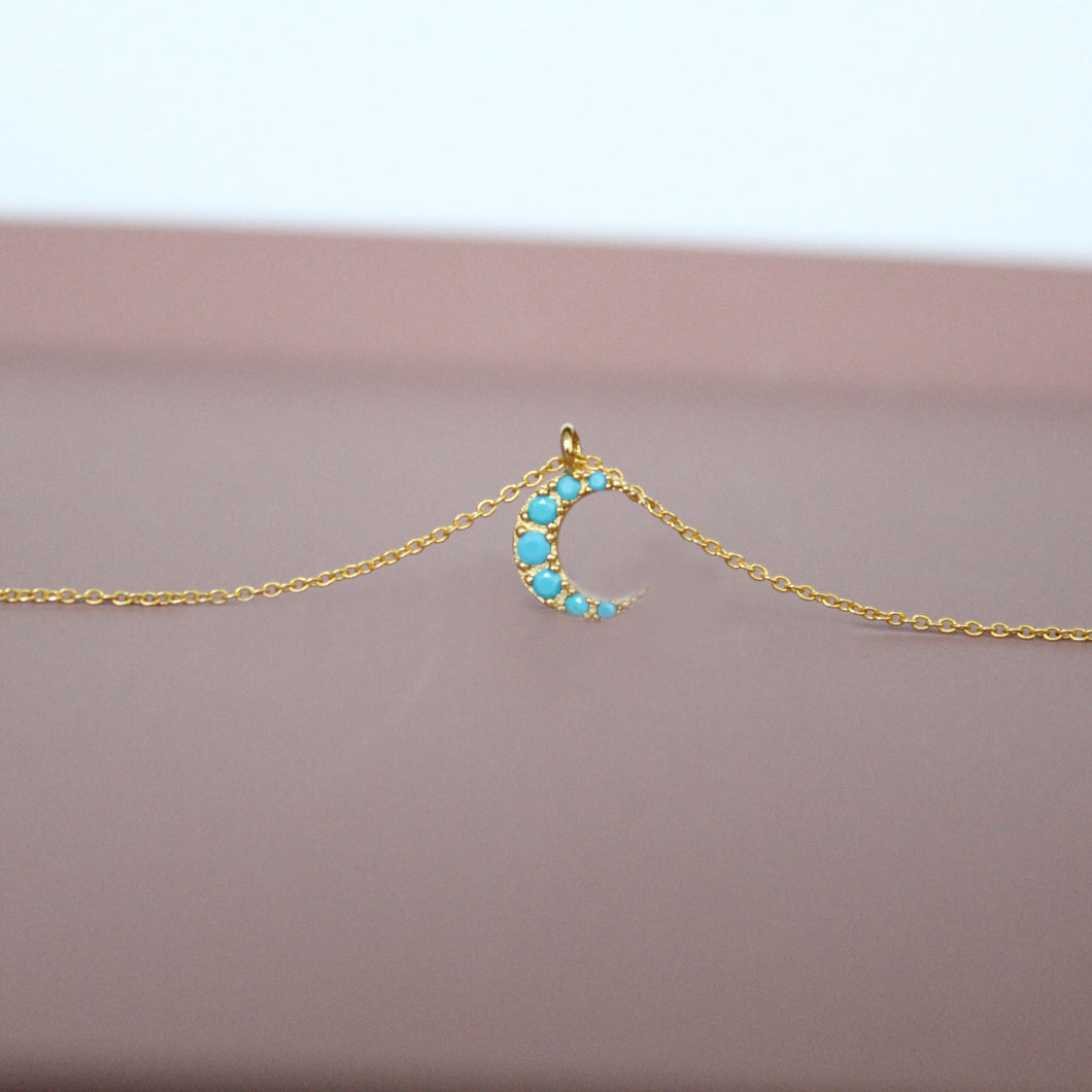 Tiny moon crescent with turquoise cubic zirconia